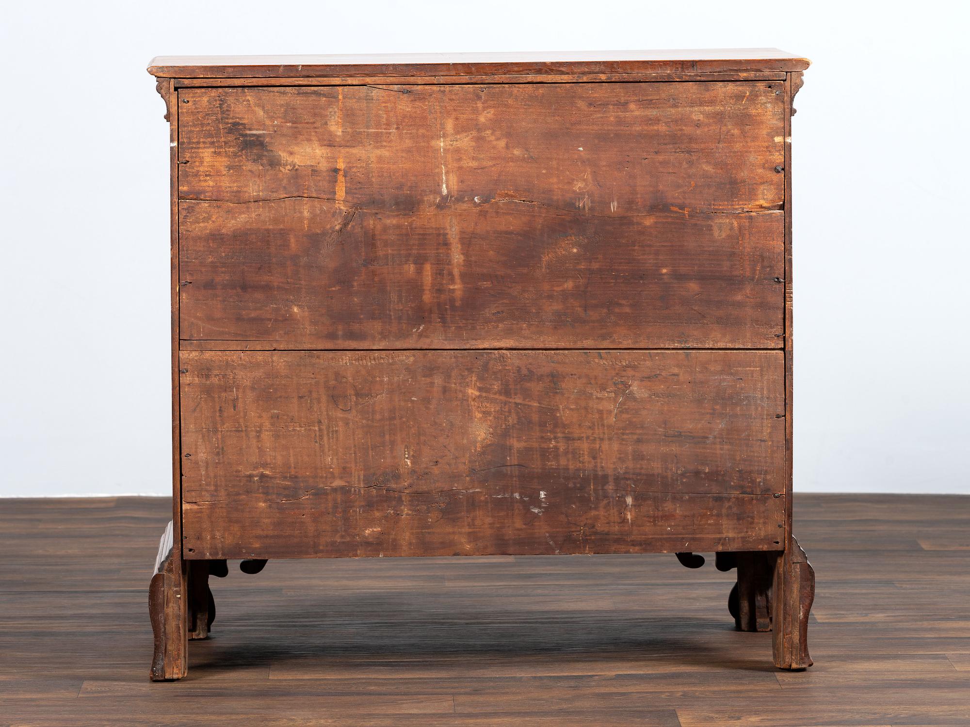 A Chippendale Shell-and-Block Carved Cherrywood Chest of Drawers