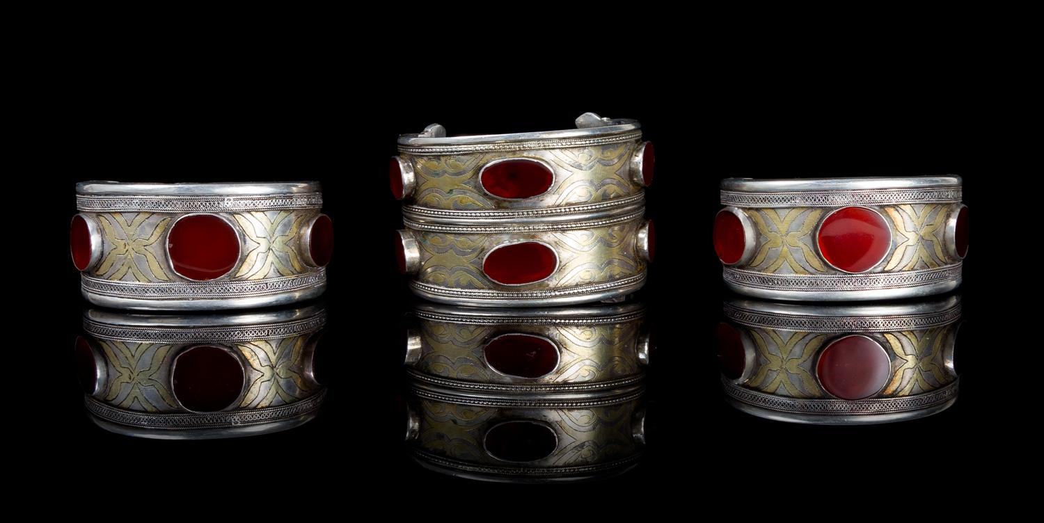 A Group of Three Carnelian Inset and Silvered Metal Bracelets Width 2 3/4 inches.
