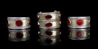 A Group of Three Carnelian Inset and Silvered Metal Bracelets Width 2 3/4 inches.