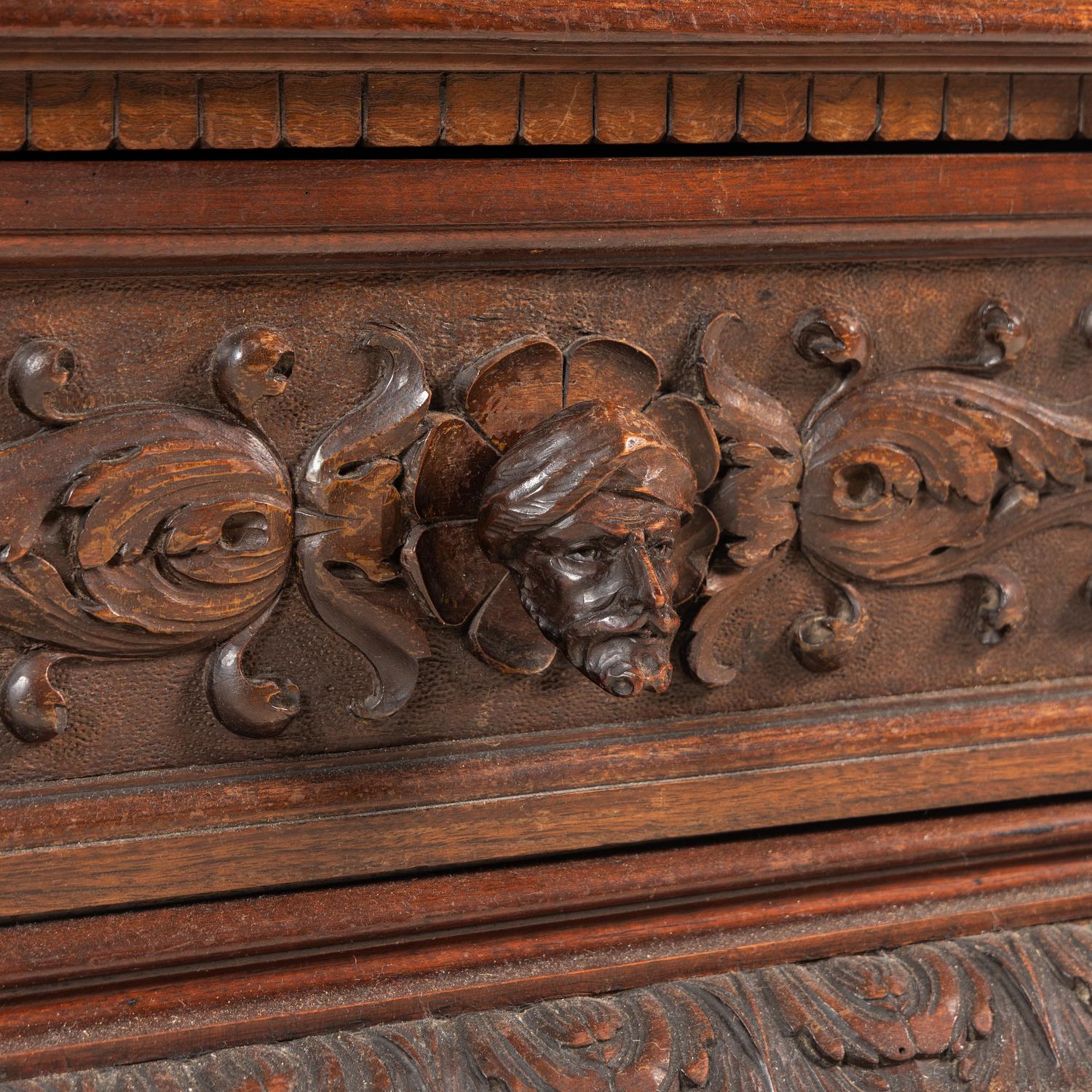 An Italian Renaissance Style Walnut and Wrought Iron Bookcase