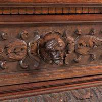 An Italian Renaissance Style Walnut and Wrought Iron Bookcase