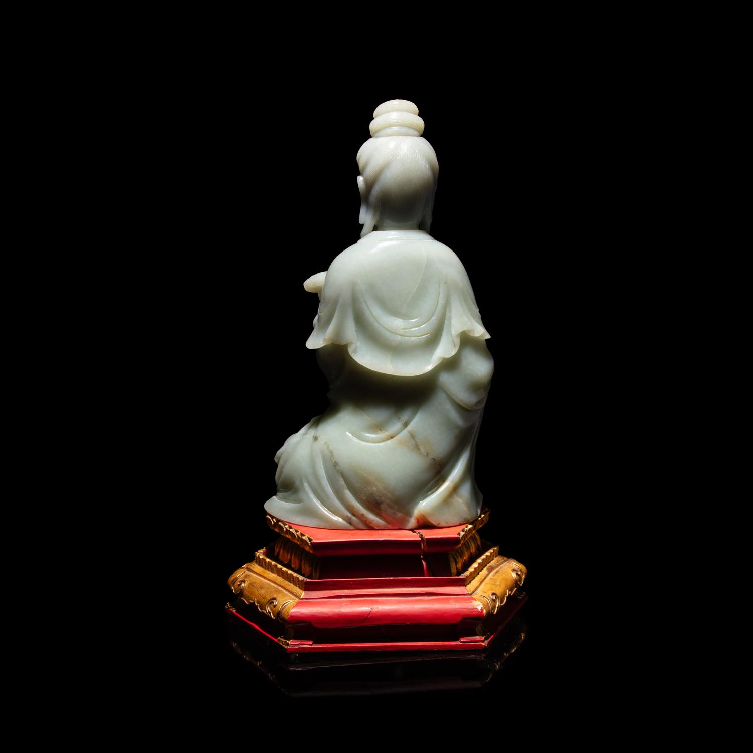 A Chinese Celadon Jade Seated Guanyin, 20th Century — 近代 青玉觀音坐像