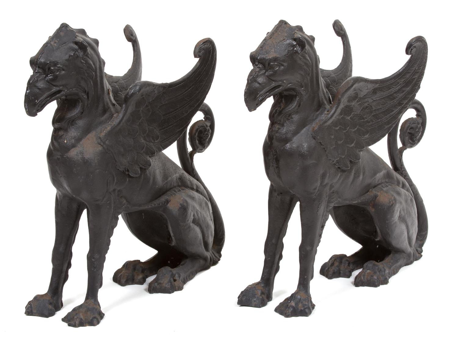A Pair of Patinated Iron Gryphons Height 22 1/2 inches. — 20TH CENTURY