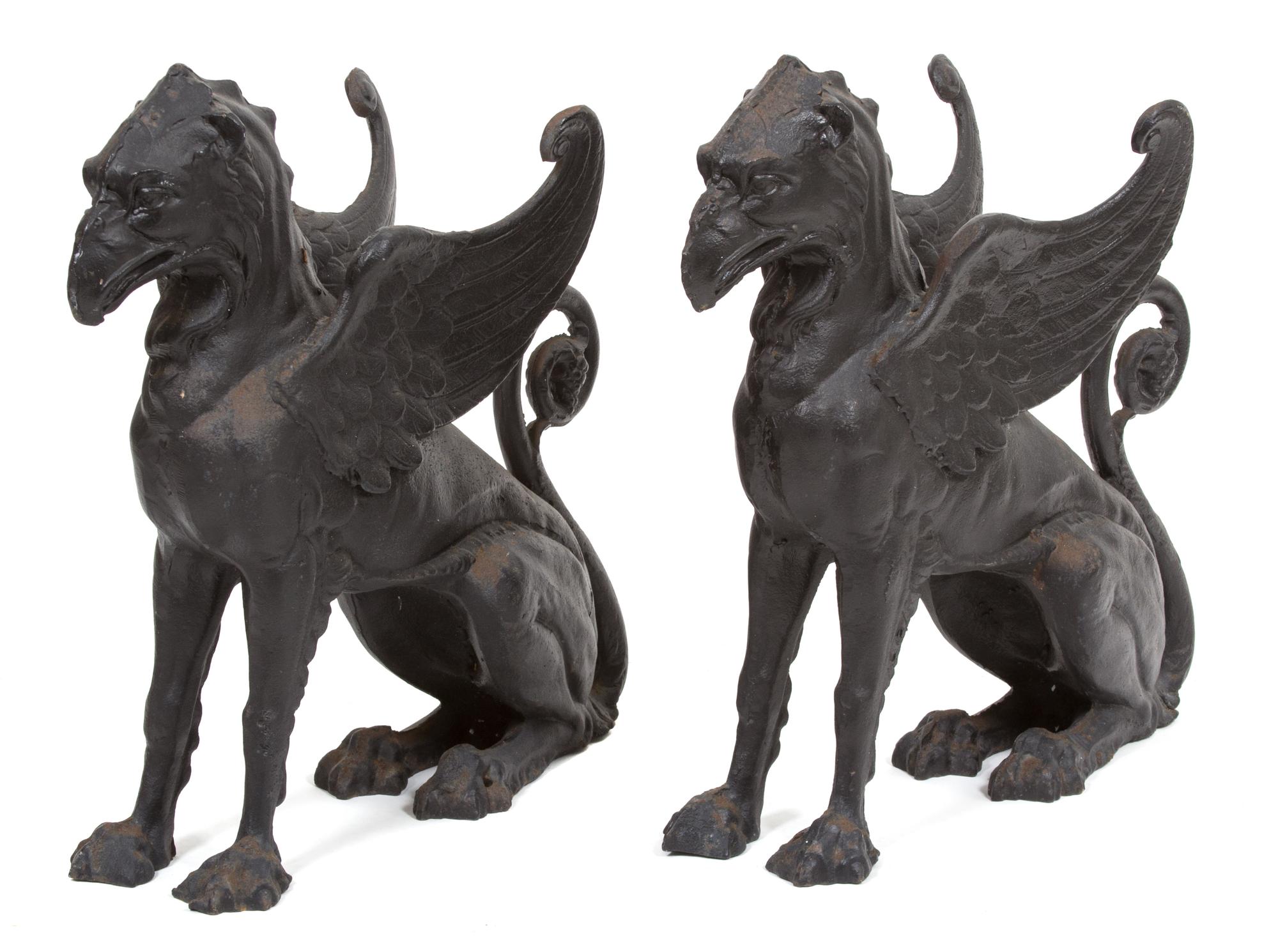 A Pair of Patinated Iron Gryphons Height 22 1/2 inches. — 20TH CENTURY