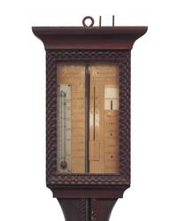 A Carved Mahogany Adjustable Barometer