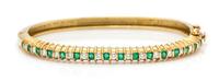An 18 Karat Yellow Gold, Emerald, and Diamond Bangle Bracelet, J. Cooper, 14.20 dwts.
