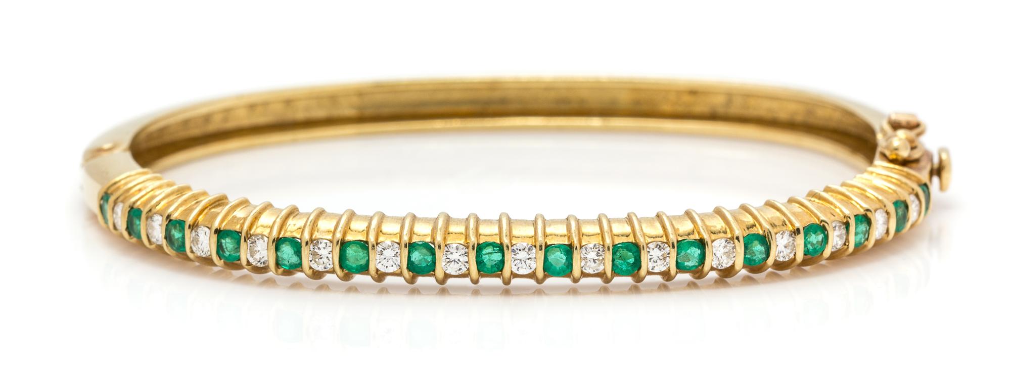 An 18 Karat Yellow Gold, Emerald, and Diamond Bangle Bracelet, J. Cooper, 14.20 dwts.