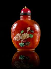 A Mother of Pearl Inlaid Agate Snuff Bottle Height 3 1/4 inches.