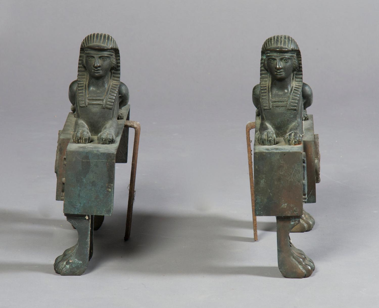 A Pair of Cast Iron Chenets, Height 11 3/4 inches.