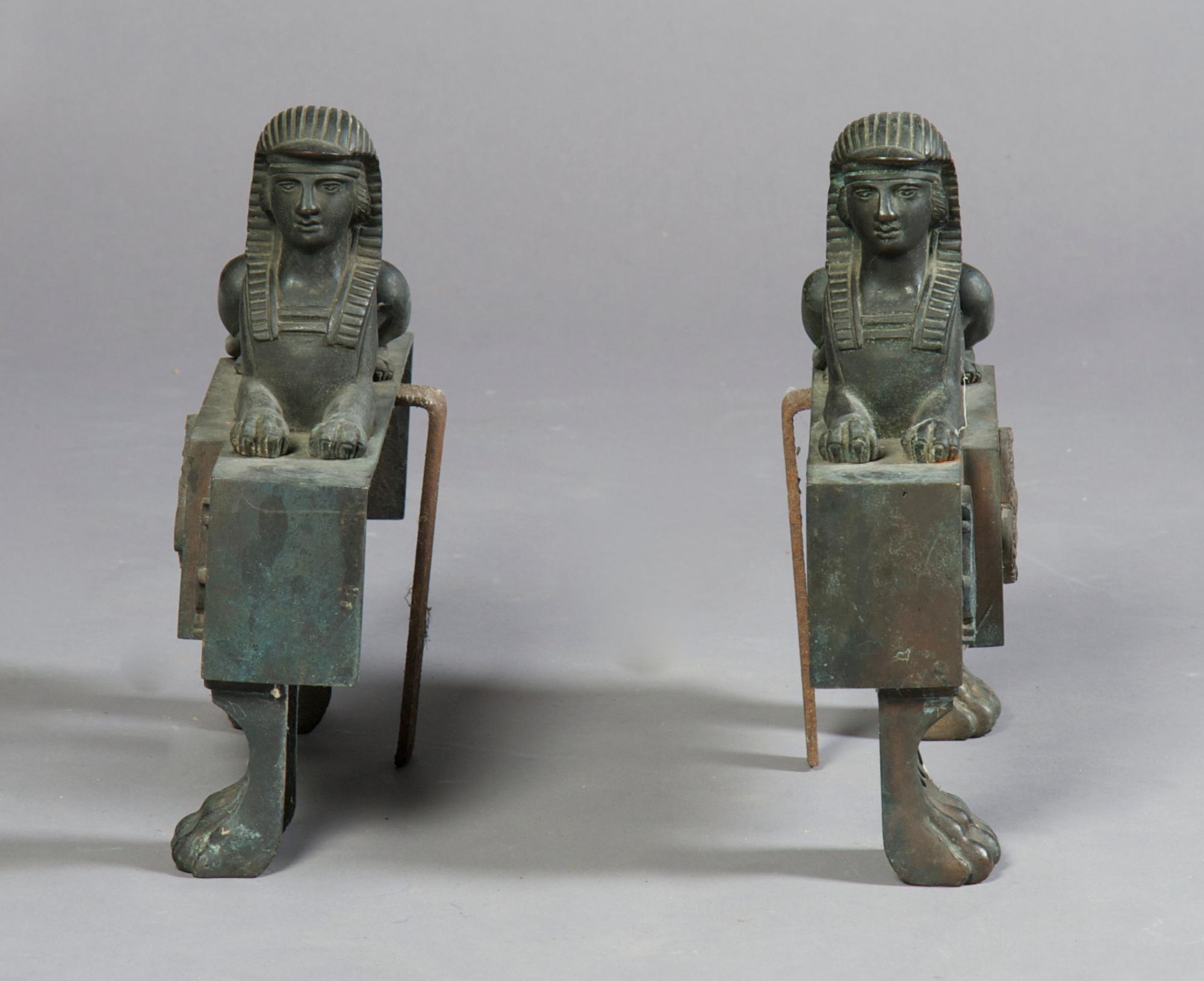 A Pair of Cast Iron Chenets, Height 11 3/4 inches.