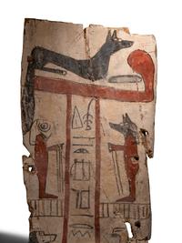 An Egyptian Painted Wood Sarcophagus Panel with Anubis