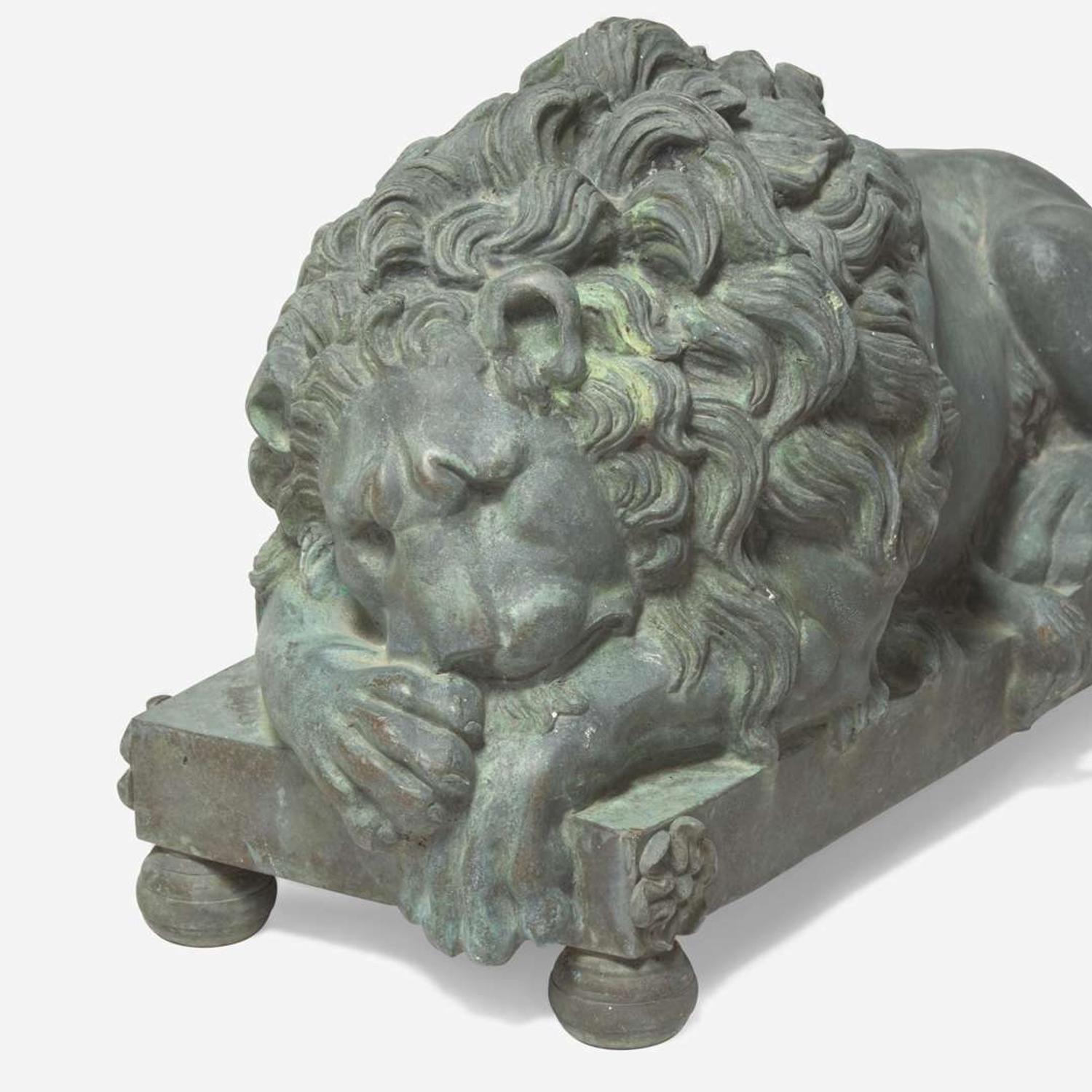 After Antonio Canova (Italian, 1757-1822) A Pair of Bronze Recumbent Lion Garden Sculptures, late 19th / 20th century