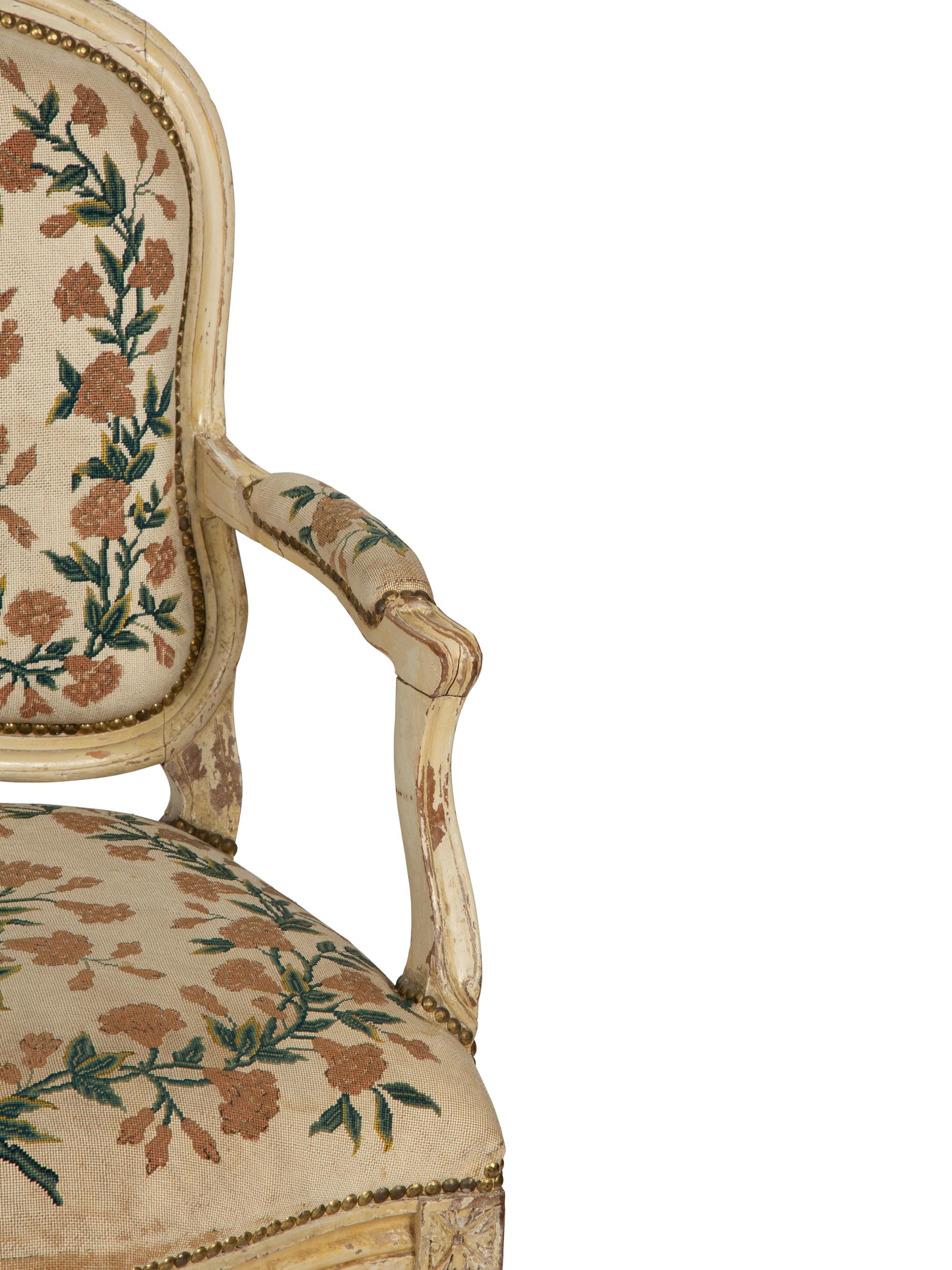 A Pair of Louis XVI Cream Painted Fauteuils