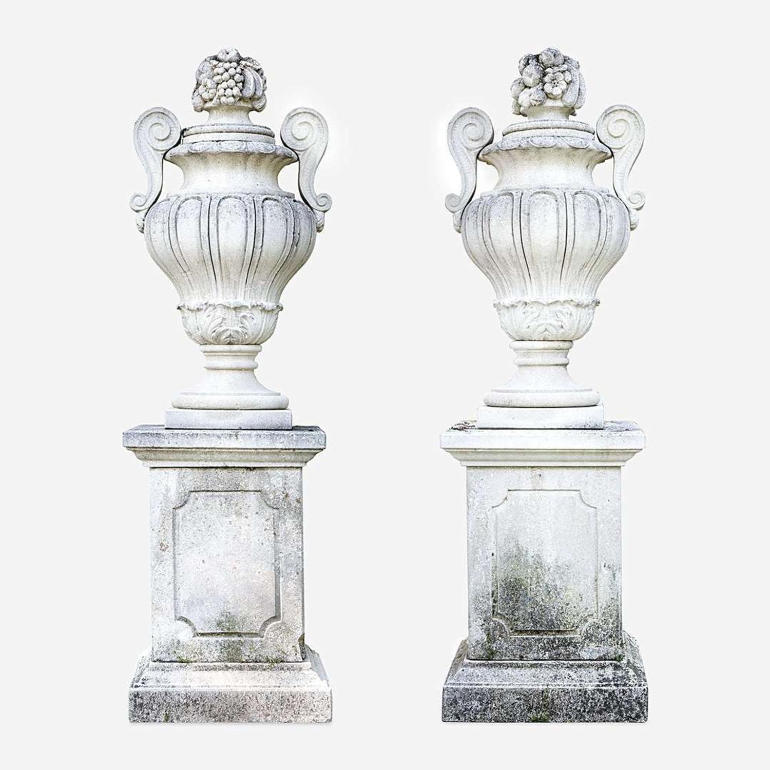 A Pair of Large Composition Stone Garden Urns on Pedestals*
