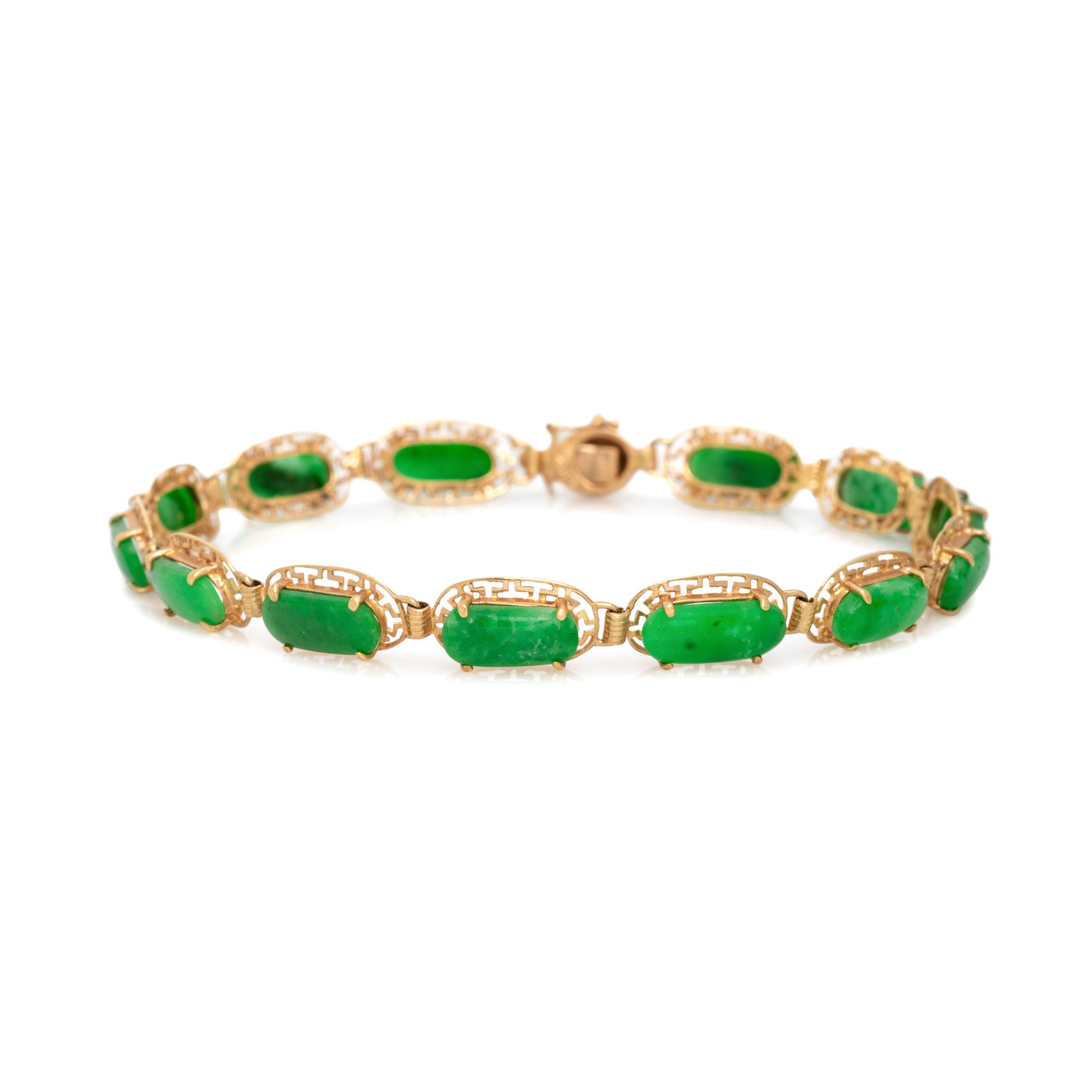 COLLECTION OF YELLOW GOLD AND JADE JEWELRY