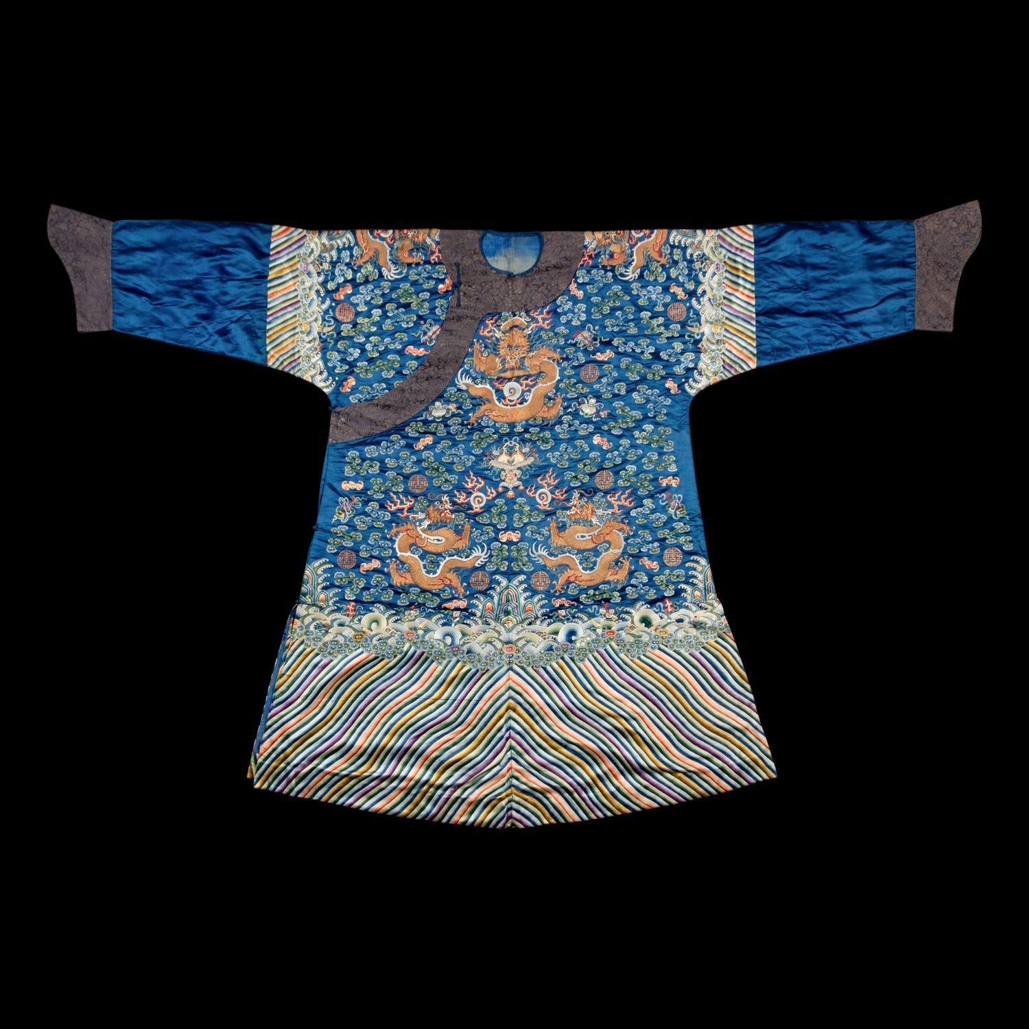 A Chinese Blue Ground Embroidered Silk 'Dragon' Robe, Jifu , 19th Century 清晚期 藍緞地綉云龍紋吉服