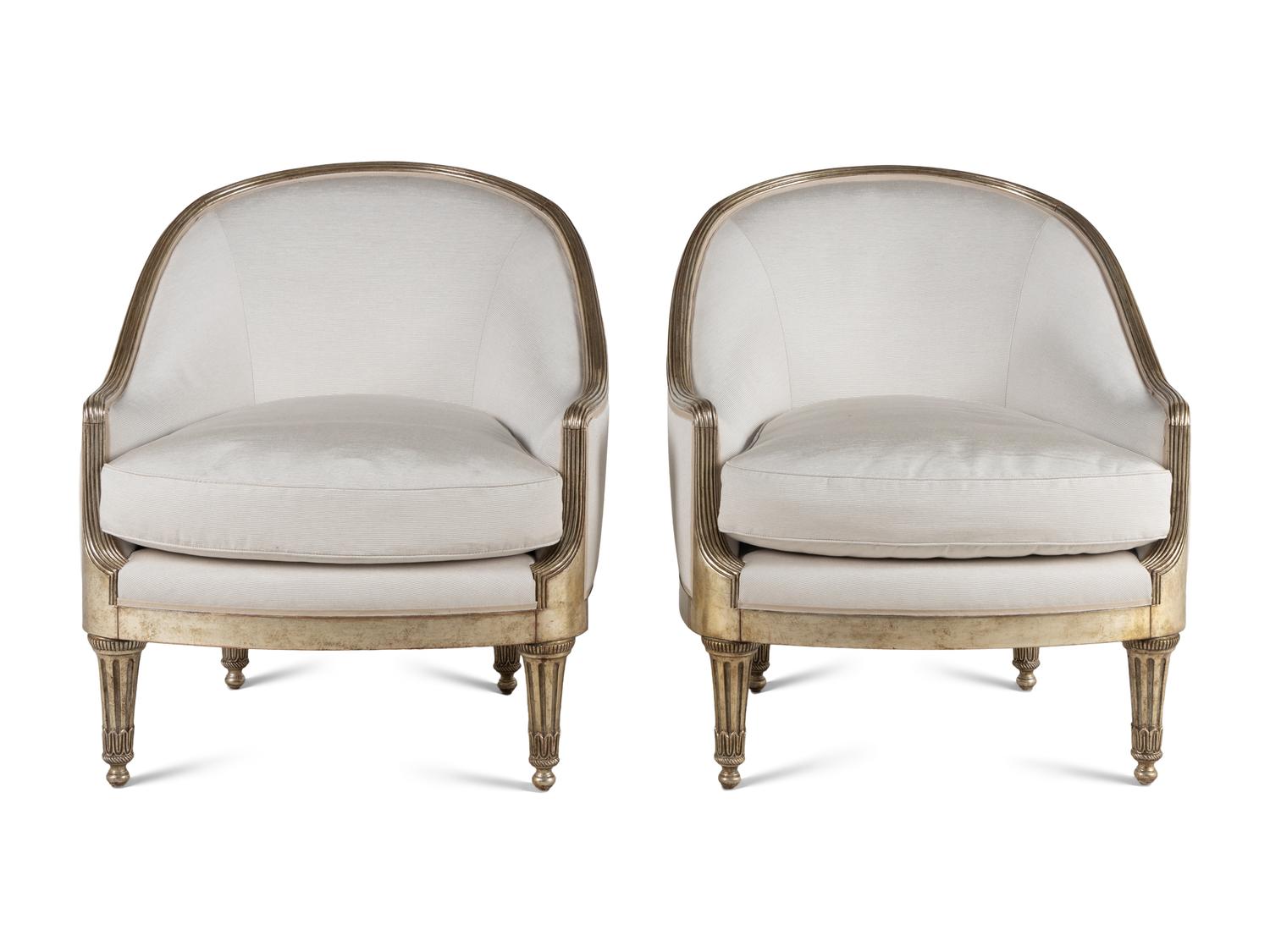 A Pair of Ebanista Silvered Wood Bergeres
