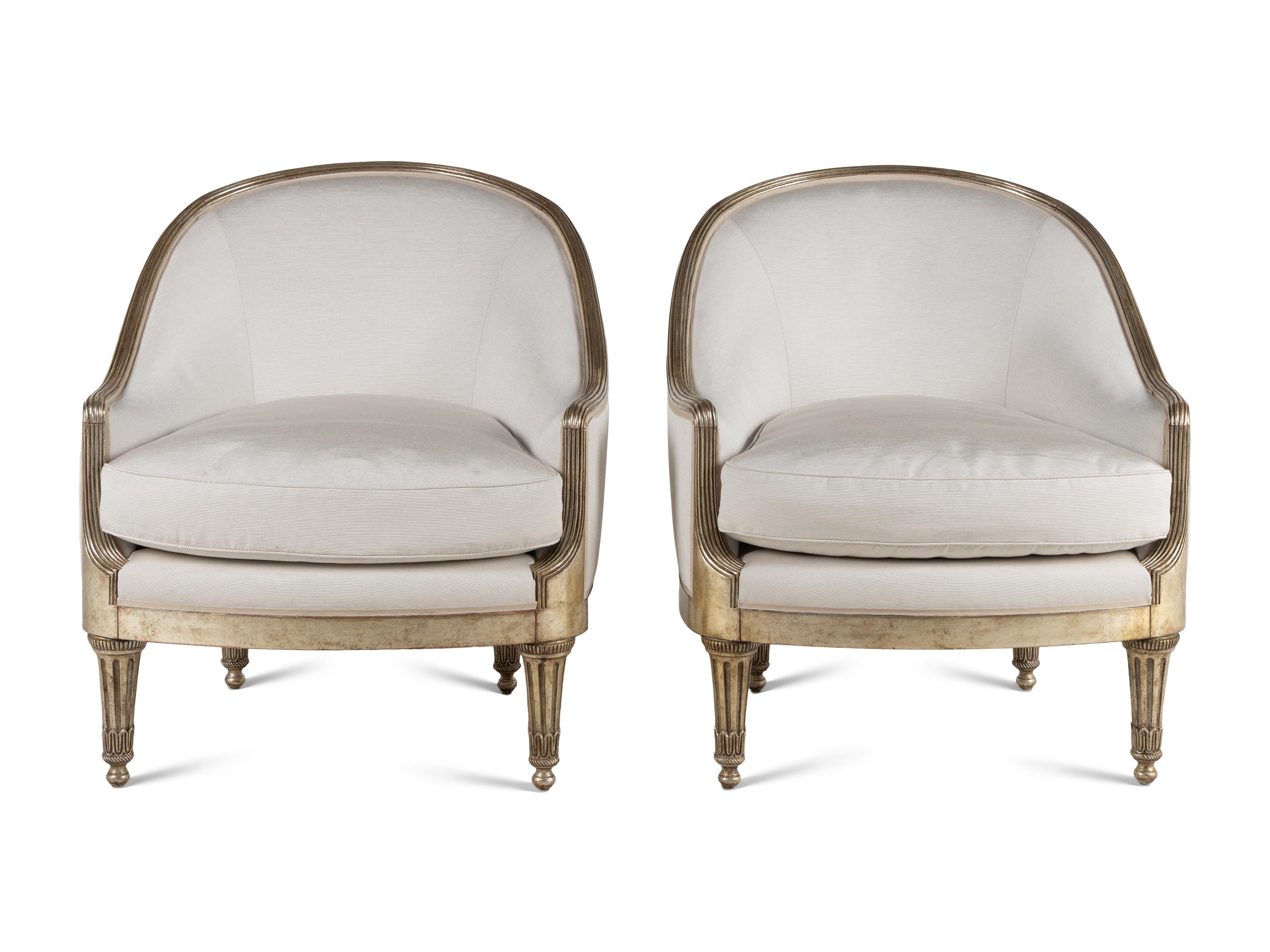 A Pair of Ebanista Silvered Wood Bergeres