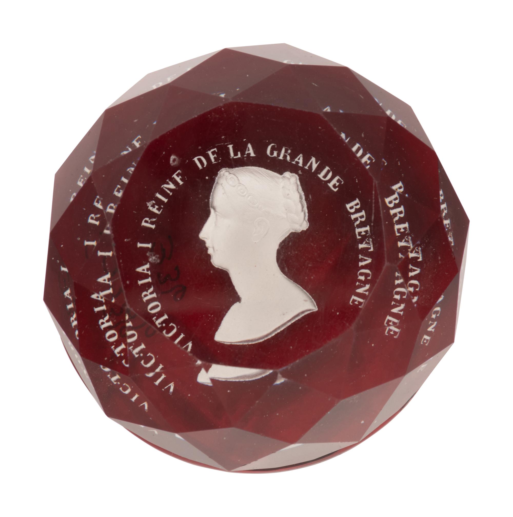 A Baccarat Queen Victoria Sulfide on Ruby Ground Faceted Glass Paperweight