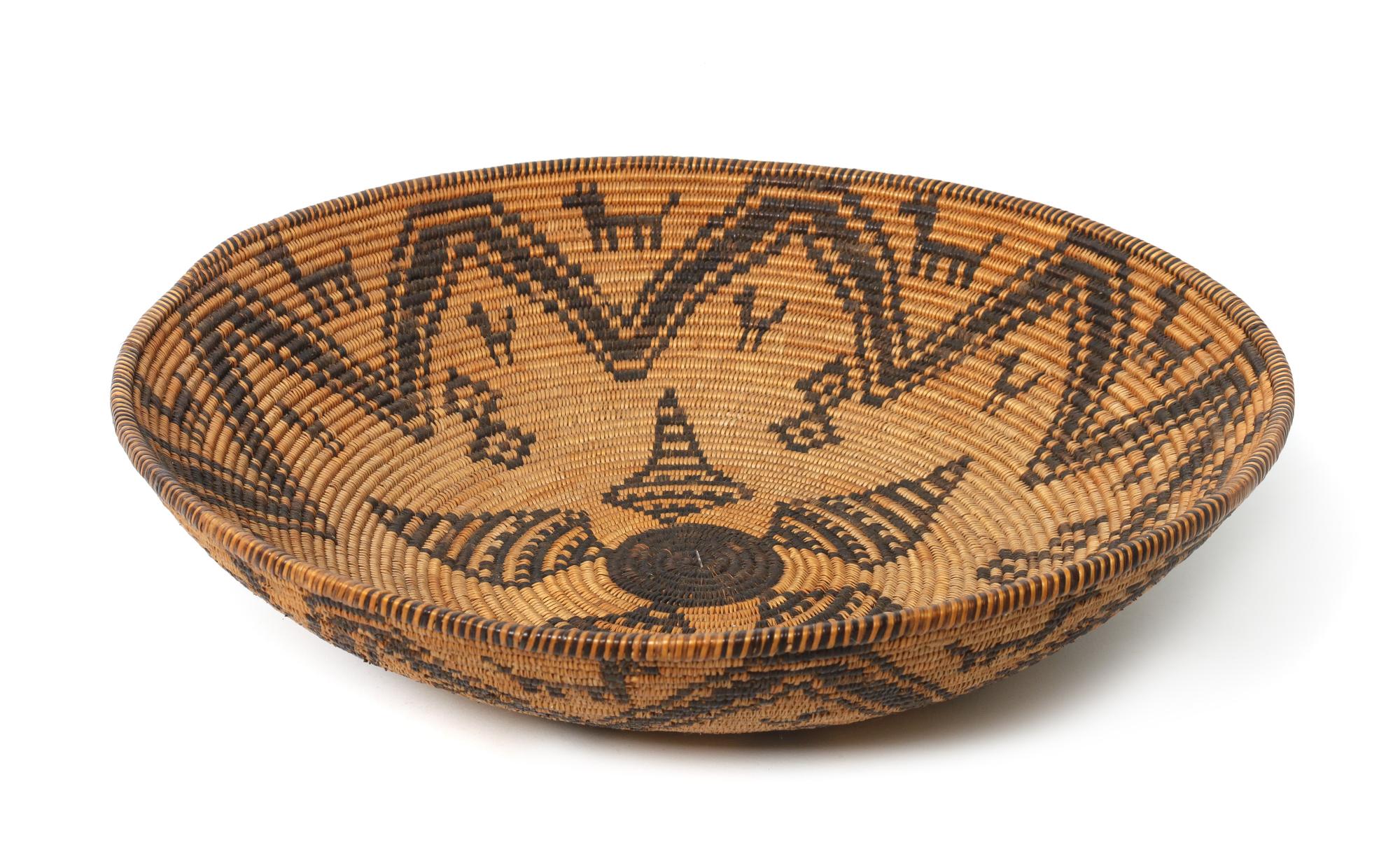 An Apache Pictorial Basketry Tray Height 4 1/4 x diameter 17 1/4 inches.