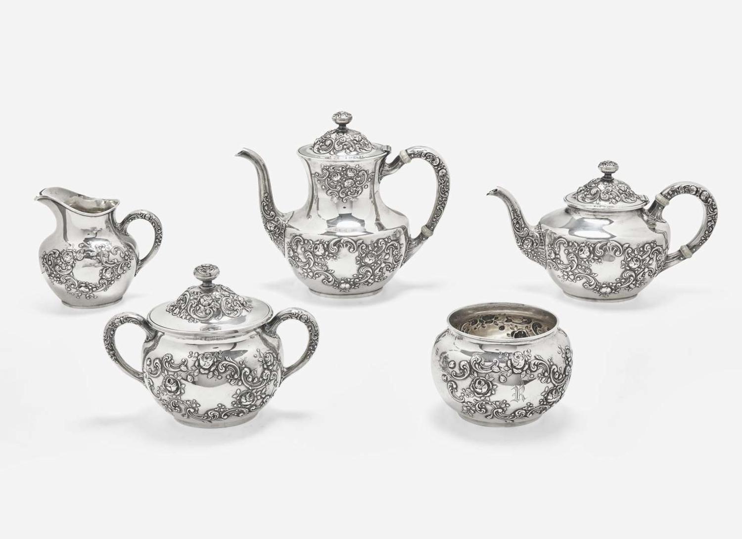 A five-piece sterling silver floral repoussé tea and coffee service, Gorham Mfg. Co., Providence, RI, bearing date mark for 1883