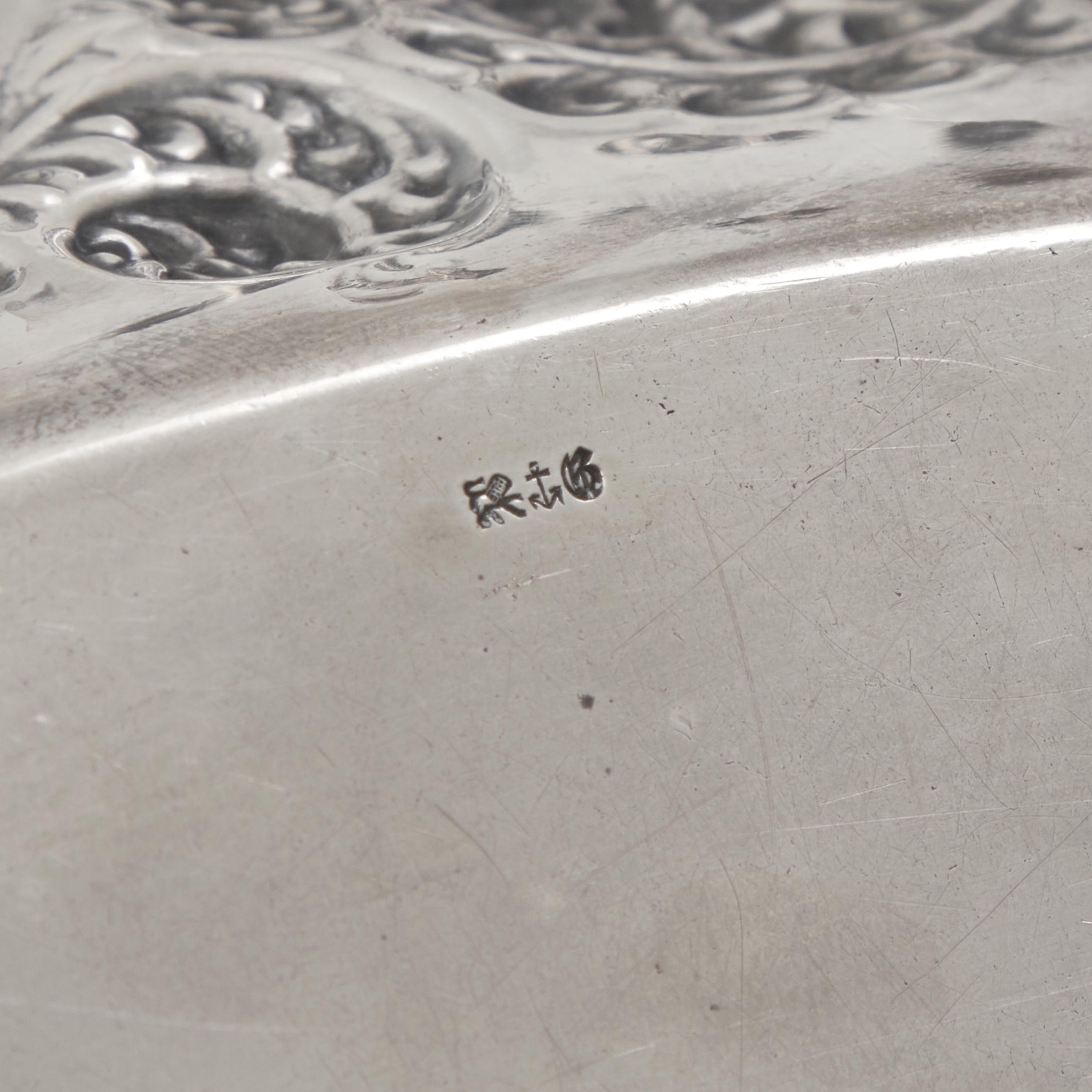 An American Aesthetic Movement Silver Repousse Bread Dish