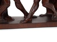 A Continental Carved Oak Figural Clock