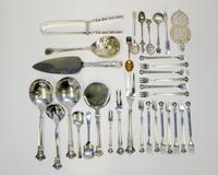 A Collection of Danish Silver Serving Articles, C.M Cohr, Copenhagen, Early 20th Century, comprising: 14 cocktail forks 1 rice spoon 1