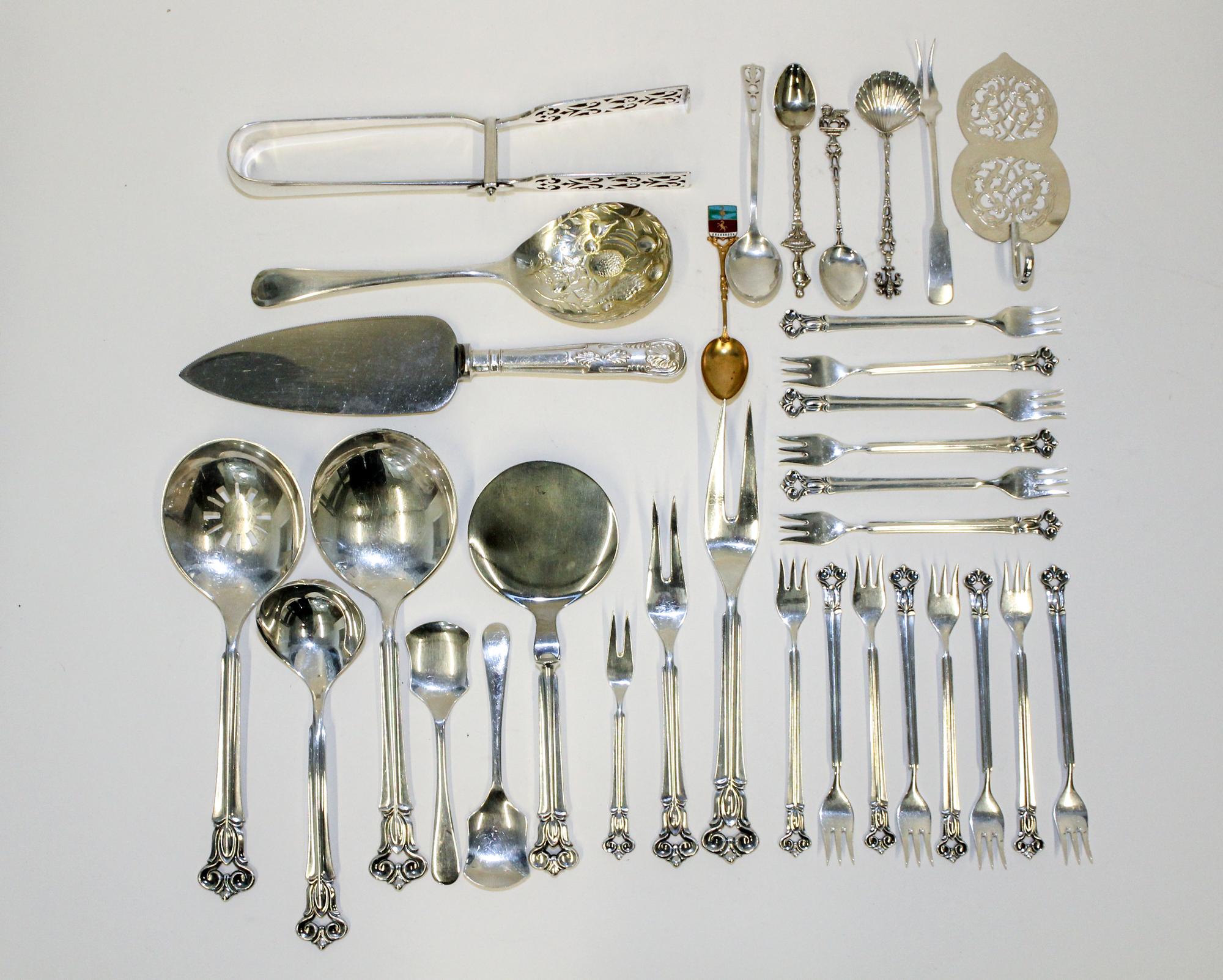 A Collection of Danish Silver Serving Articles, C.M Cohr, Copenhagen, Early 20th Century, comprising: 14 cocktail forks 1 rice spoon 1