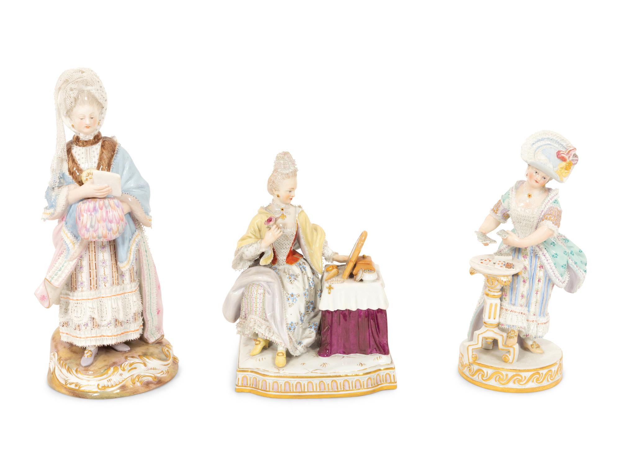 Three Meissen Porcelain Figures of Ladies in Lacy Dresses