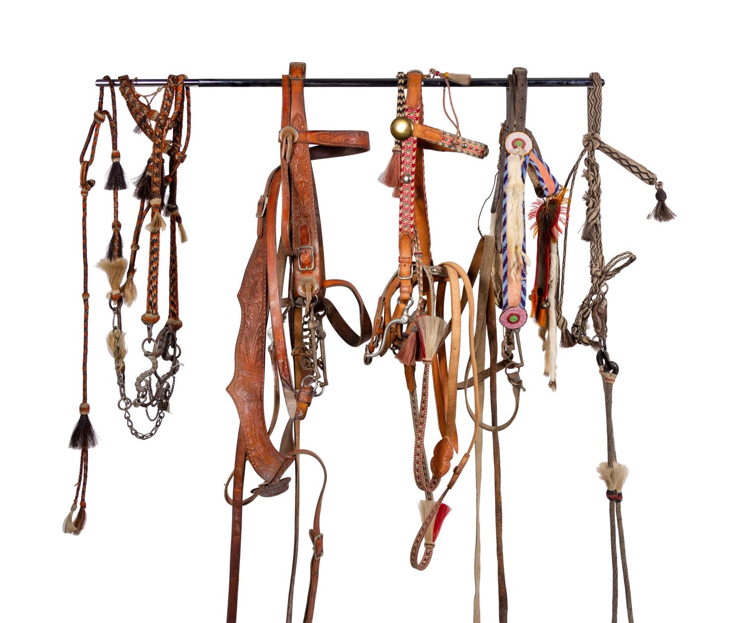 A Group of Western Horse Bridles and Quirts
