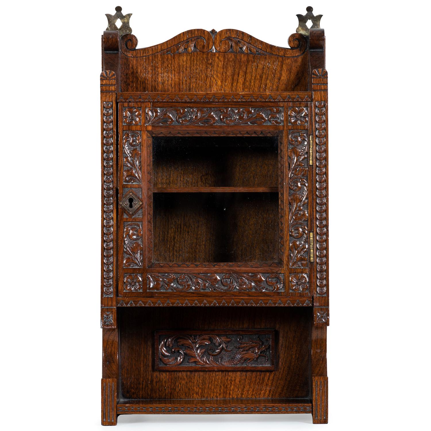 A Cincinnati Art-Carved Wall Cabinet in Walnut