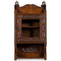 A Cincinnati Art-Carved Wall Cabinet in Walnut