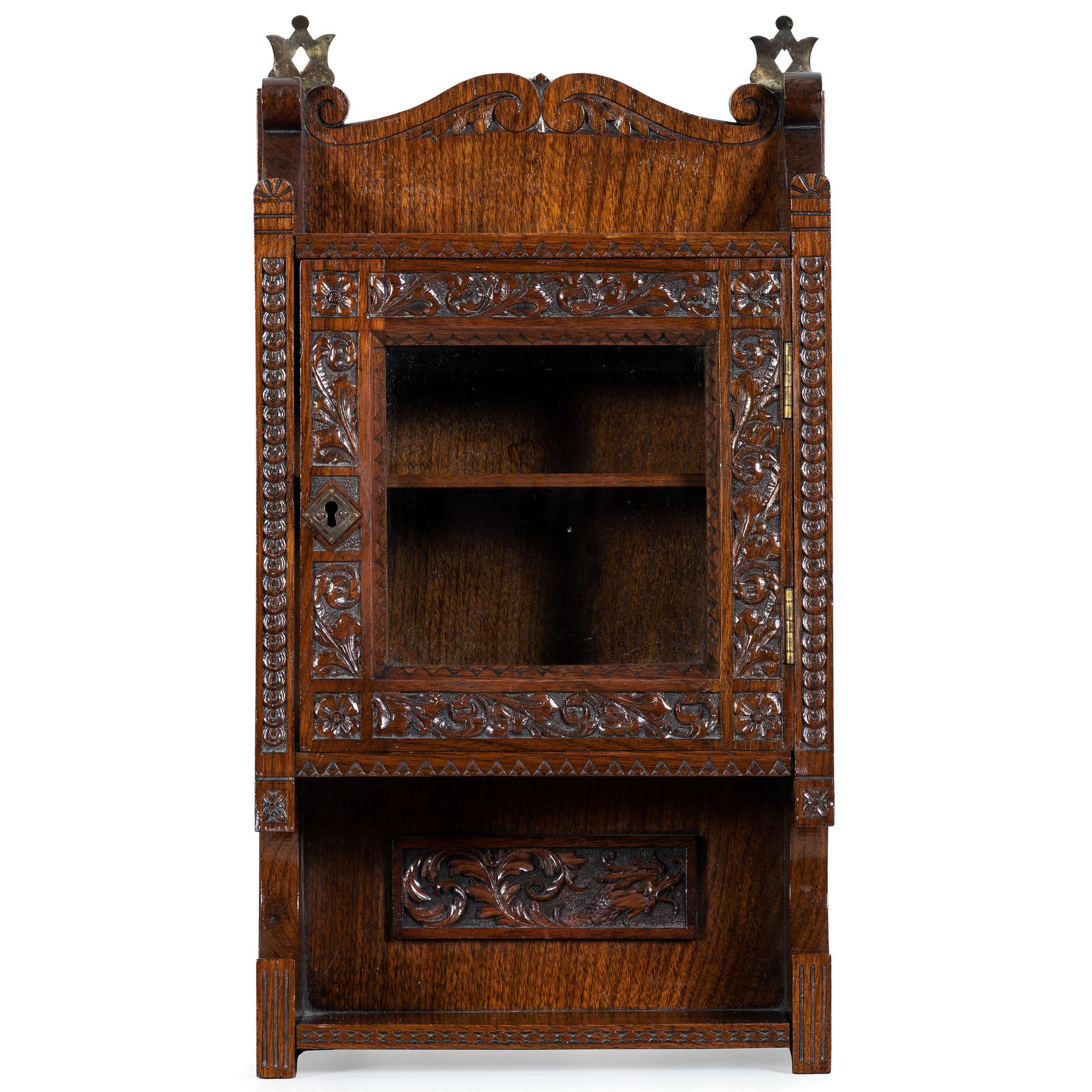 A Cincinnati Art-Carved Wall Cabinet in Walnut