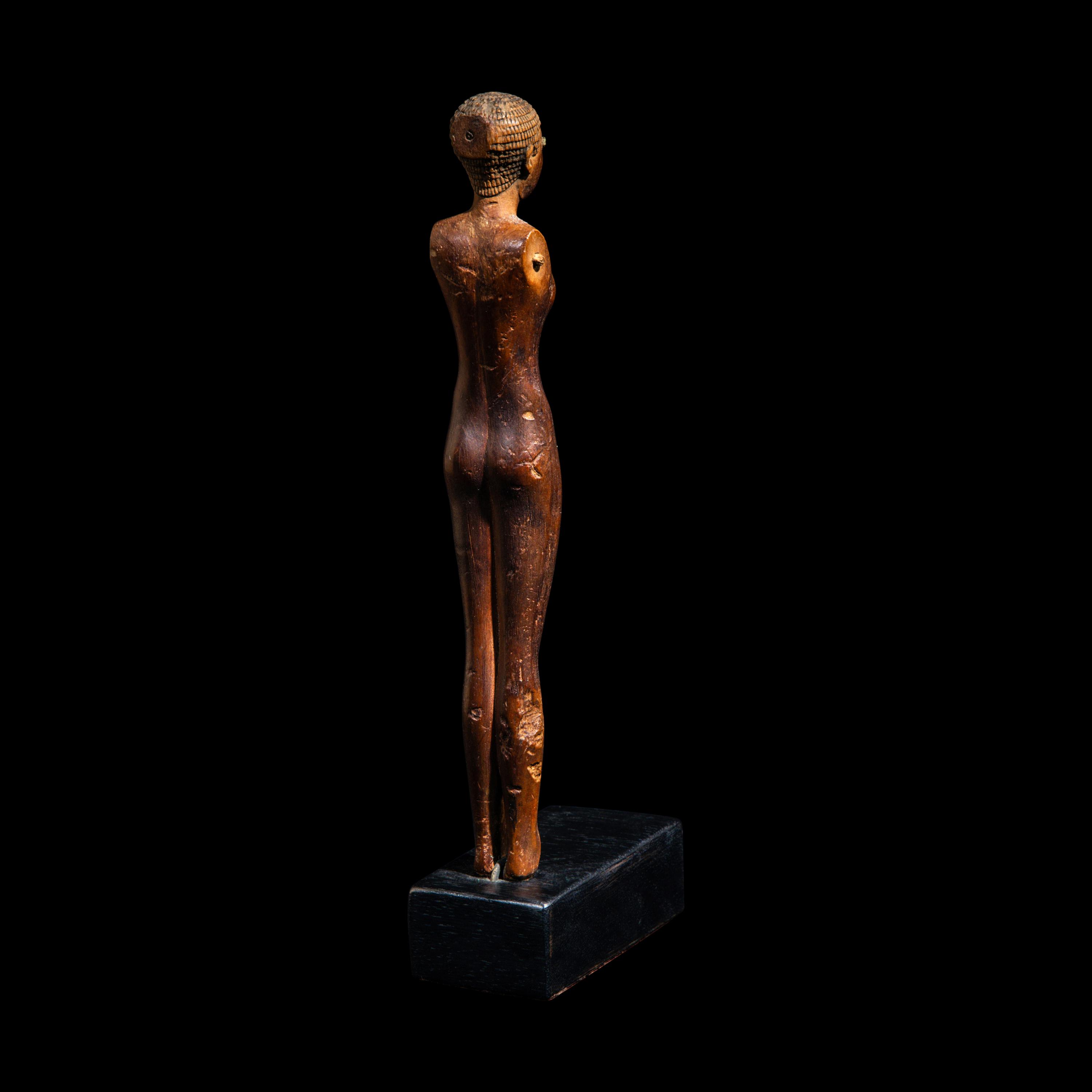 An Egyptian Wood Female Figure
