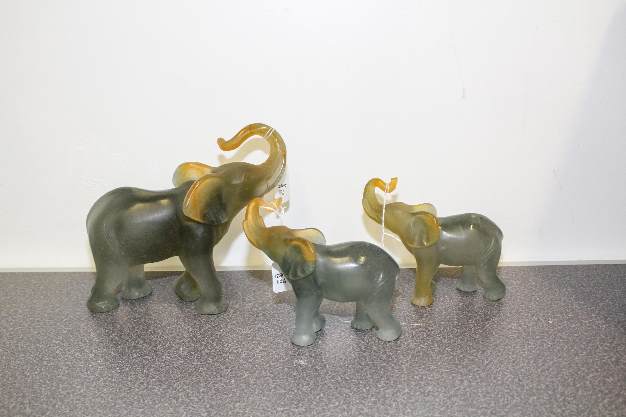 A Group of Three Daum Pate de Verre Elephant Figures Height of tallest 7 7/8 inches.