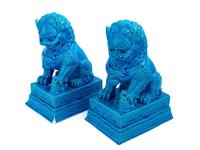 A Pair of Chinese Turquoise Glazed Porcelain Figures of Fu Lions