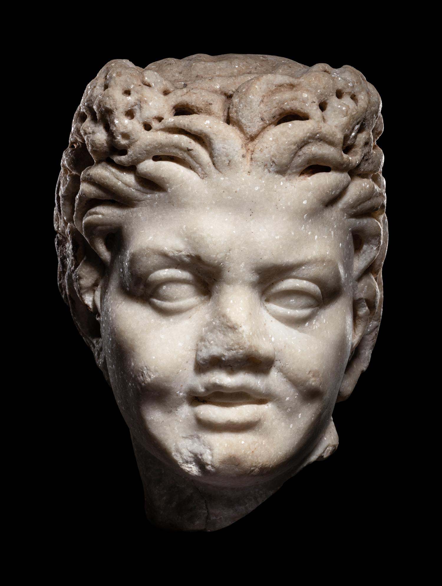 A Roman Marble Satyr Head
