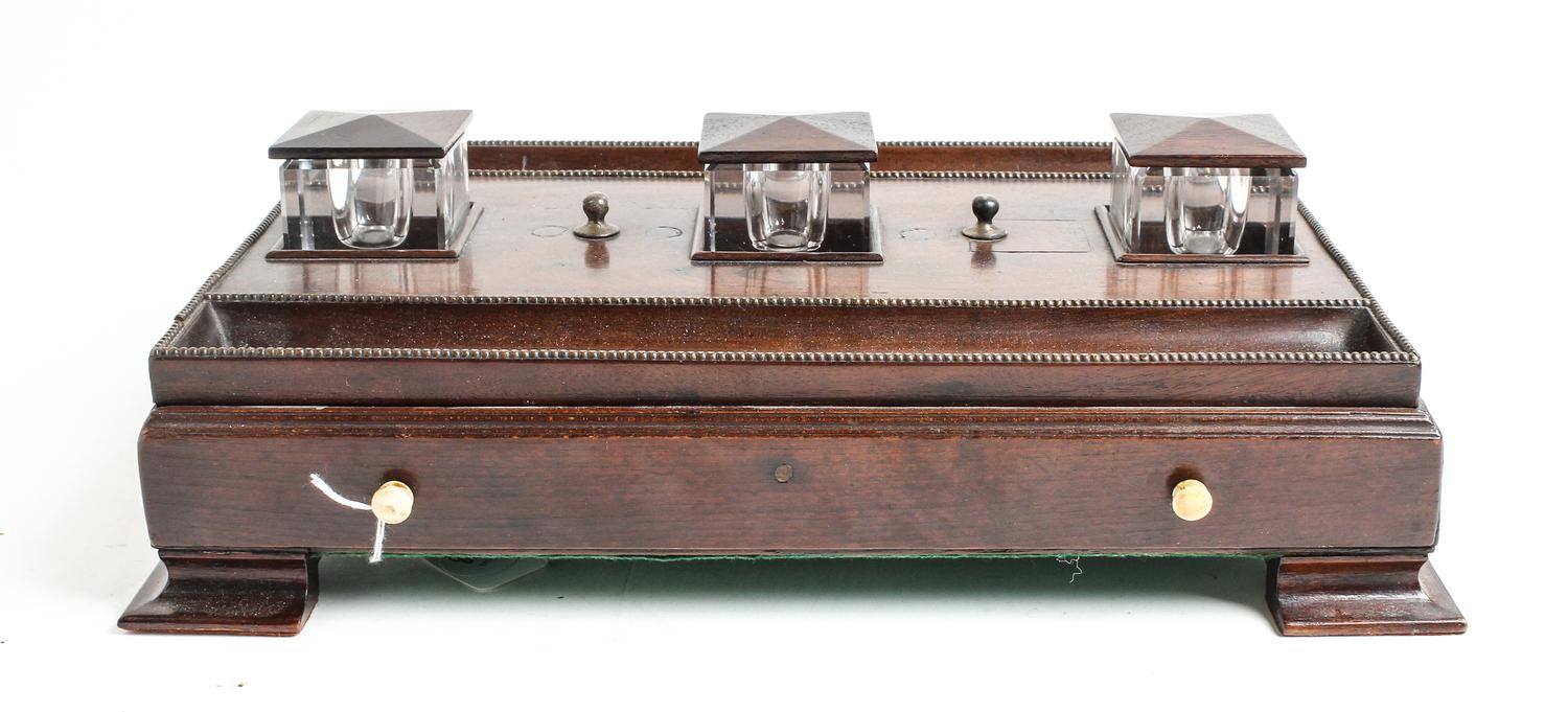 An English Mahogany Standish Height 3 1/2 x width 16 1/4 x depth 11 1/4 inches (of base).