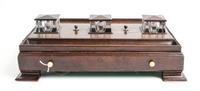 An English Mahogany Standish Height 3 1/2 x width 16 1/4 x depth 11 1/4 inches (of base).