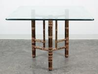 An American Bamboo and Rattan Table and Chairs Height of chairs 34 inches. — MCGUIRE FURNITURE CO.
