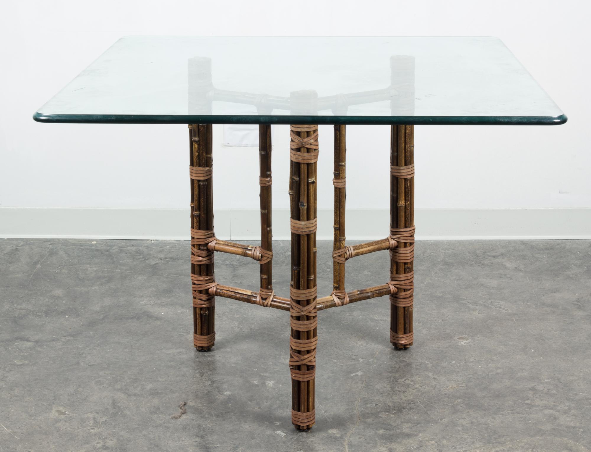 An American Bamboo and Rattan Table and Chairs Height of chairs 34 inches. — MCGUIRE FURNITURE CO.