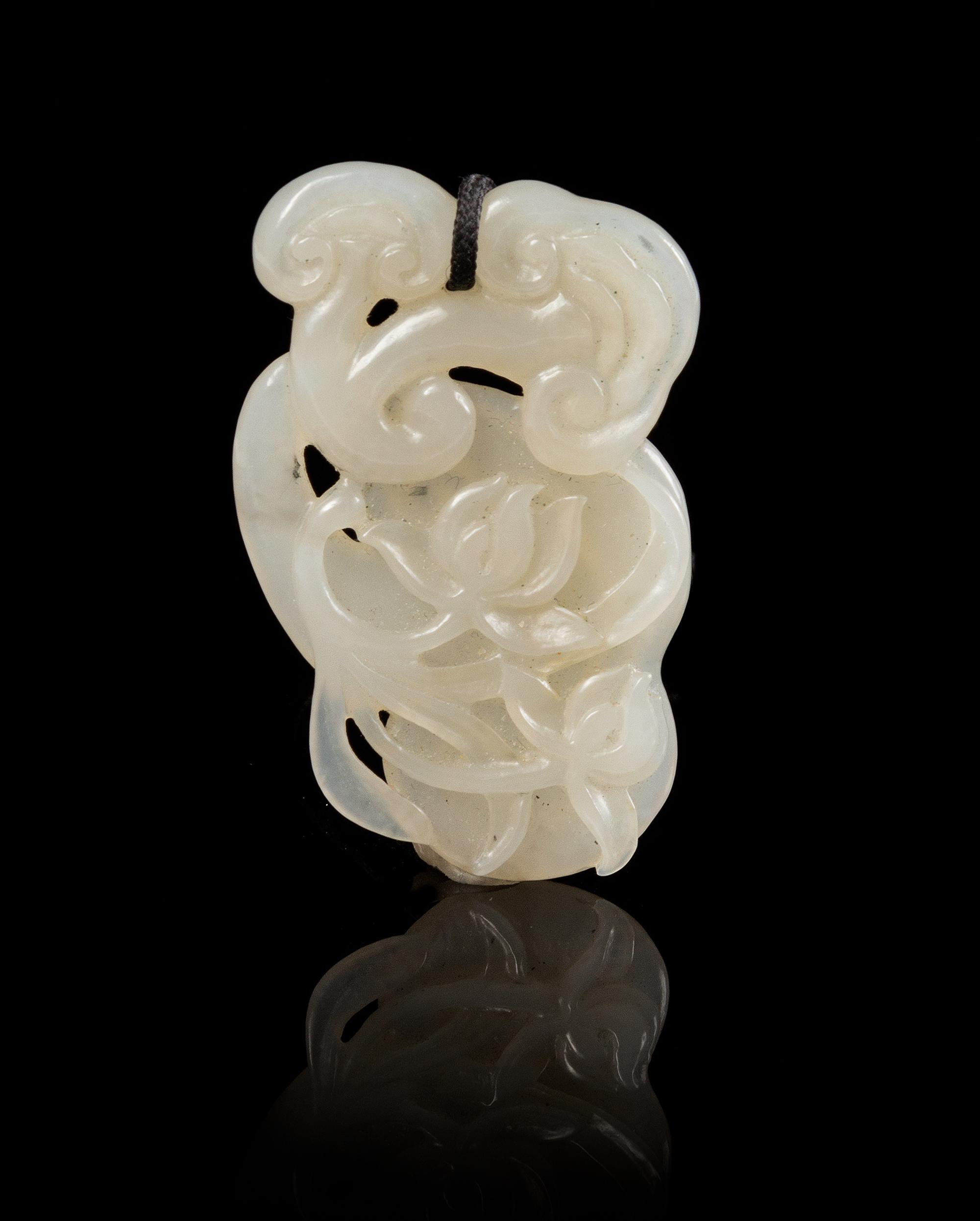 A Carved Jade Toggle Length 2 inches.