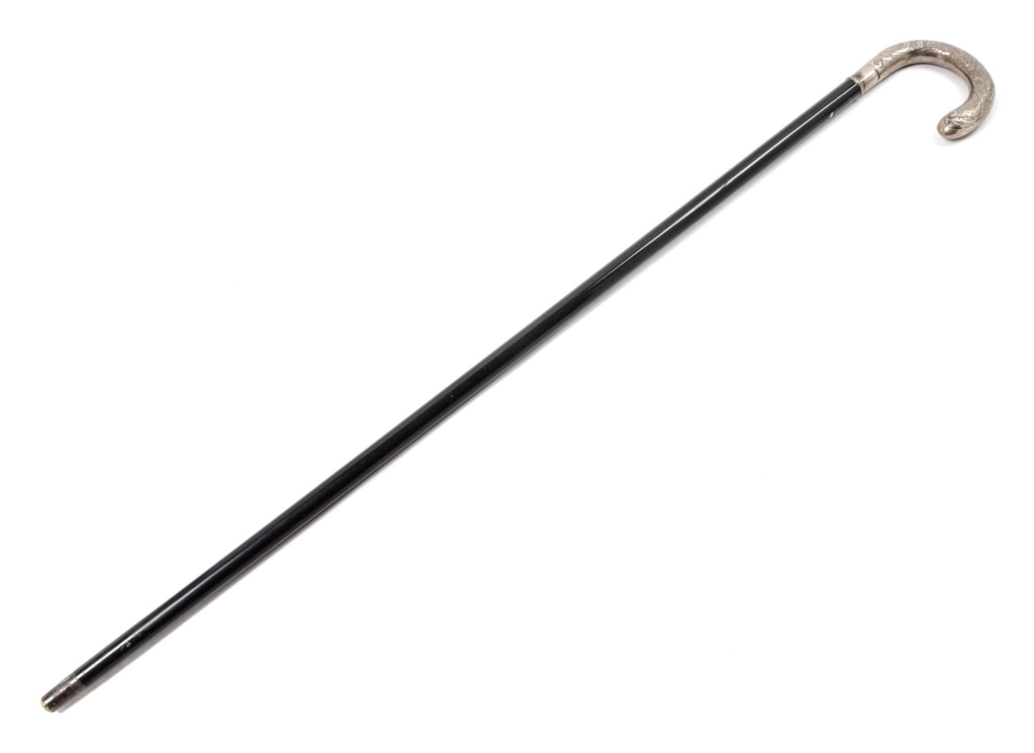 A Continental Silver Handled Ebonized Cane. Length 35 1/2 inches.