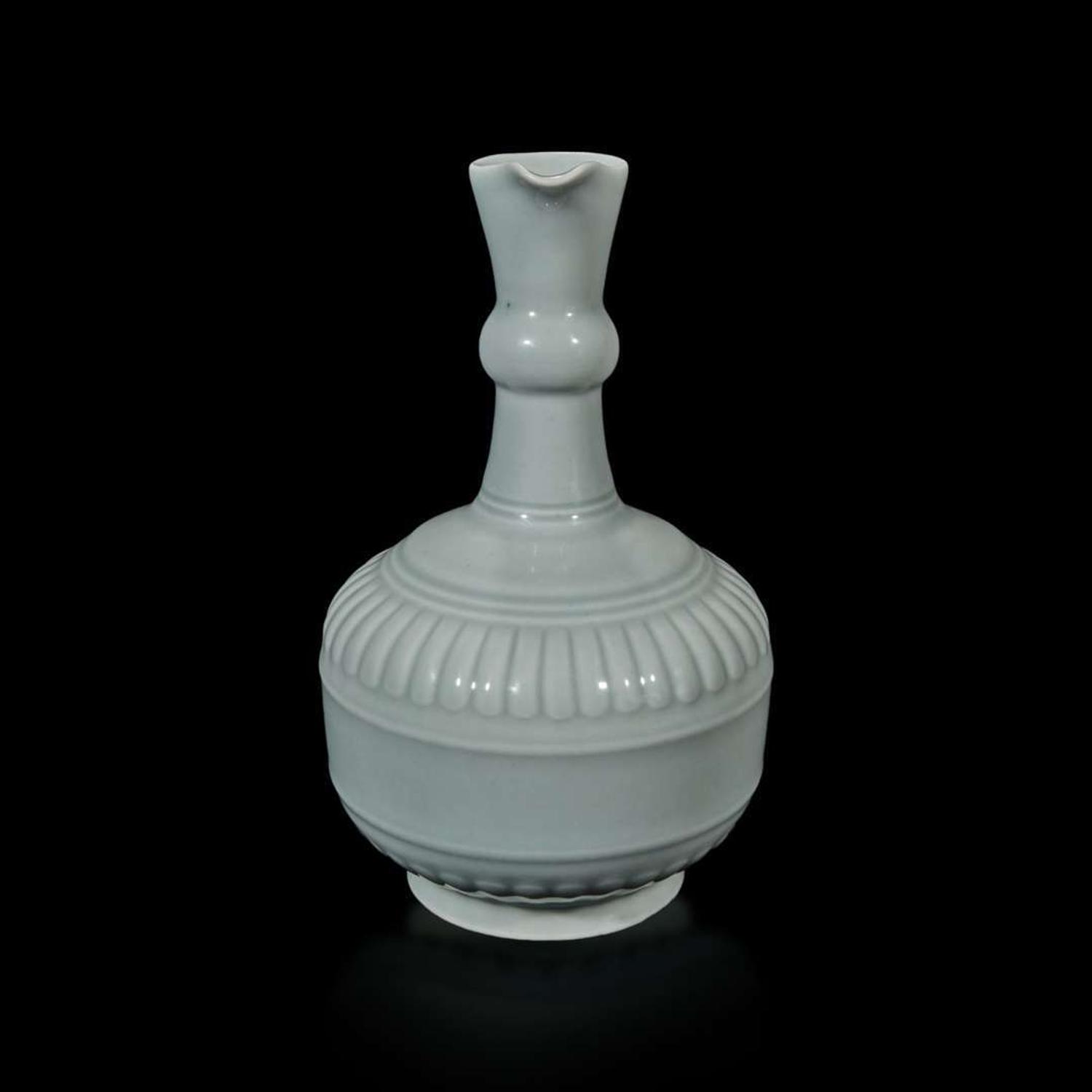 A Chinese "claire de lune" or pale celadon-glazed pouring vessel, Huajiao 粉青釉花浇