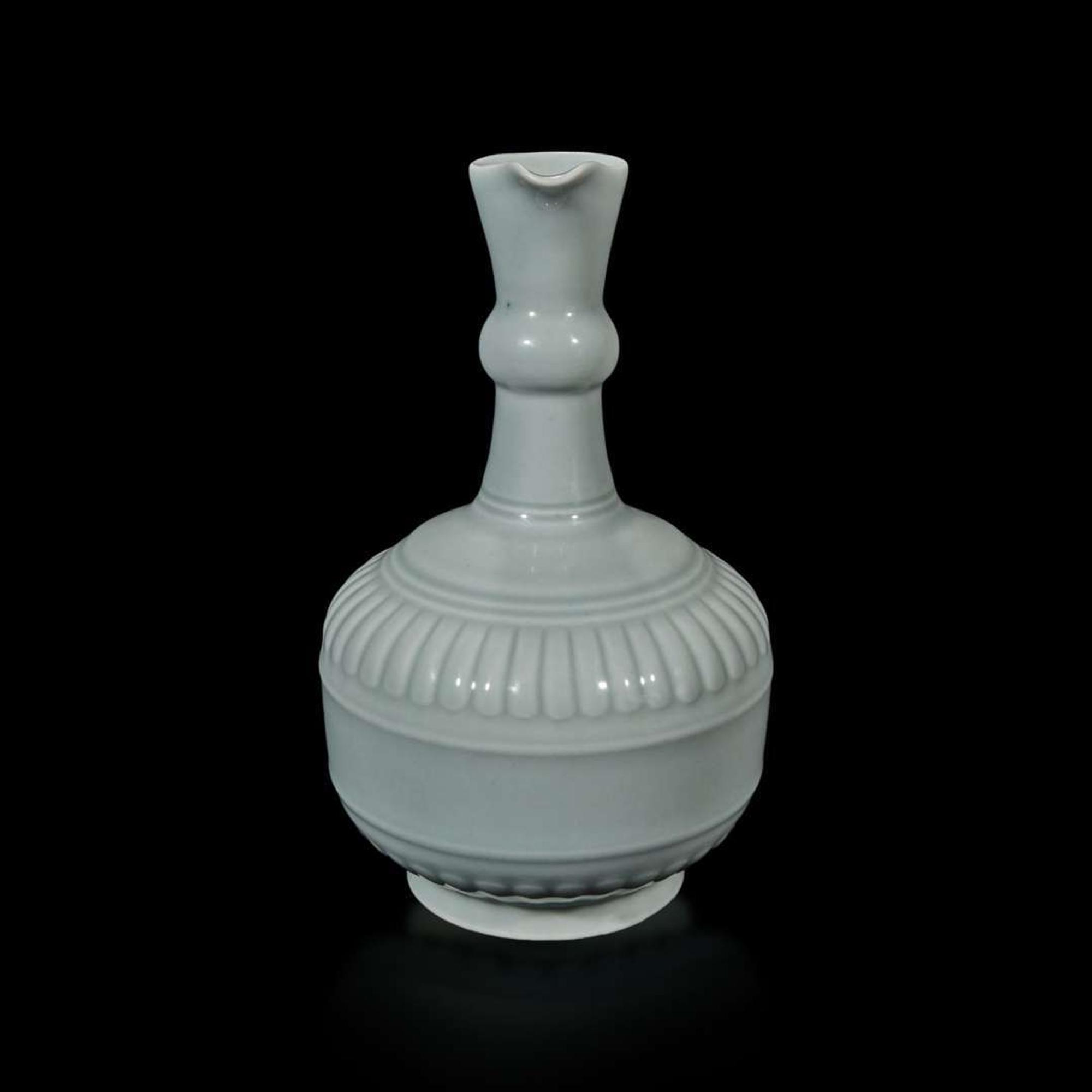 A Chinese "claire de lune" or pale celadon-glazed pouring vessel, Huajiao 粉青釉花浇