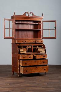 A Late Federal Cherry Wood and Tiger Maple Roll-Top Desk-and-Bookcase