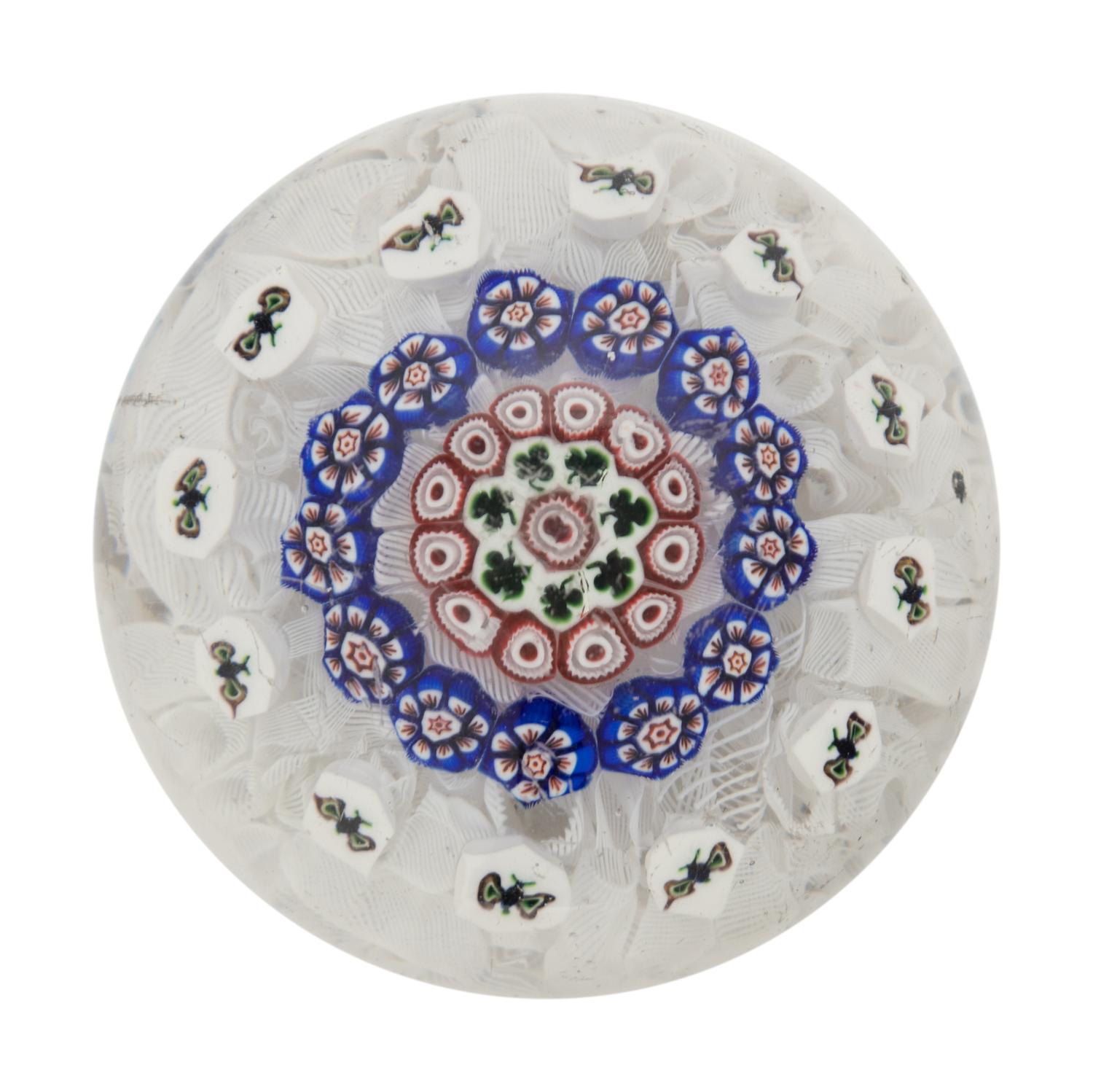A Baccarat Concentric Patterned Shamrock and Butterfly Millefiori on Upset Muslin Glass Paperweight