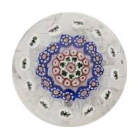 A Baccarat Concentric Patterned Shamrock and Butterfly Millefiori on Upset Muslin Glass Paperweight