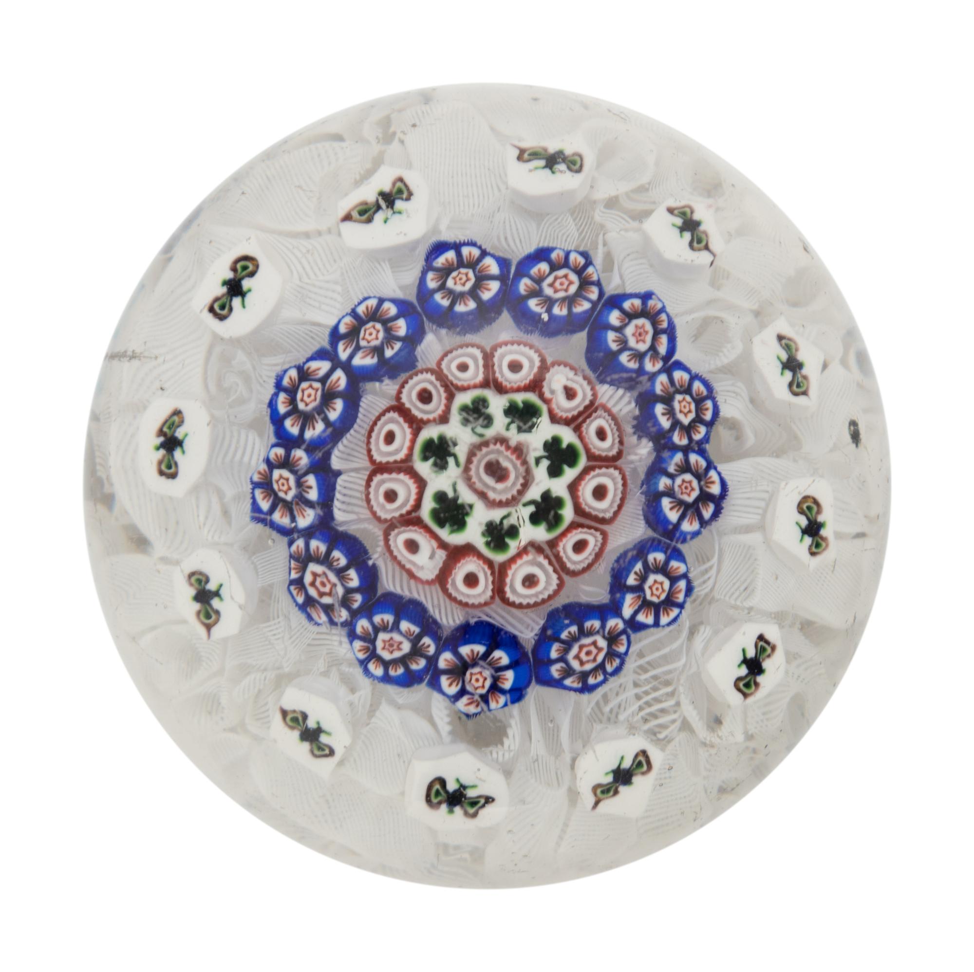 A Baccarat Concentric Patterned Shamrock and Butterfly Millefiori on Upset Muslin Glass Paperweight